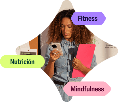 Checking into the Wellhub app, a woman is tapping into her wellbeing through kickboxing, nutrition, and mindfulness guidance.