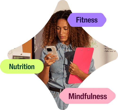 Checking into the Wellhub app, a woman is tapping into her wellbeing through kickboxing, nutrition and mindfulness