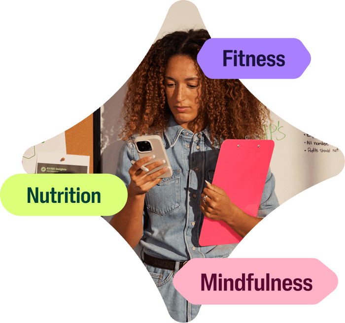 Checking into the Wellhub app, a woman is tapping into her wellbeing through fitness, nutrition and mindfulness guidance.