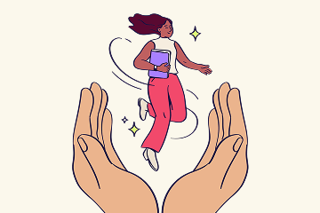 A woman holding a notebook leaps joyfully between two large, cupped supportive hands.