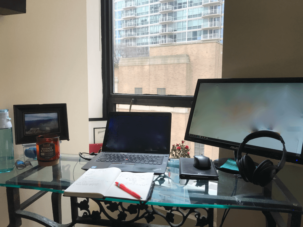 Desk with a computer and headphones