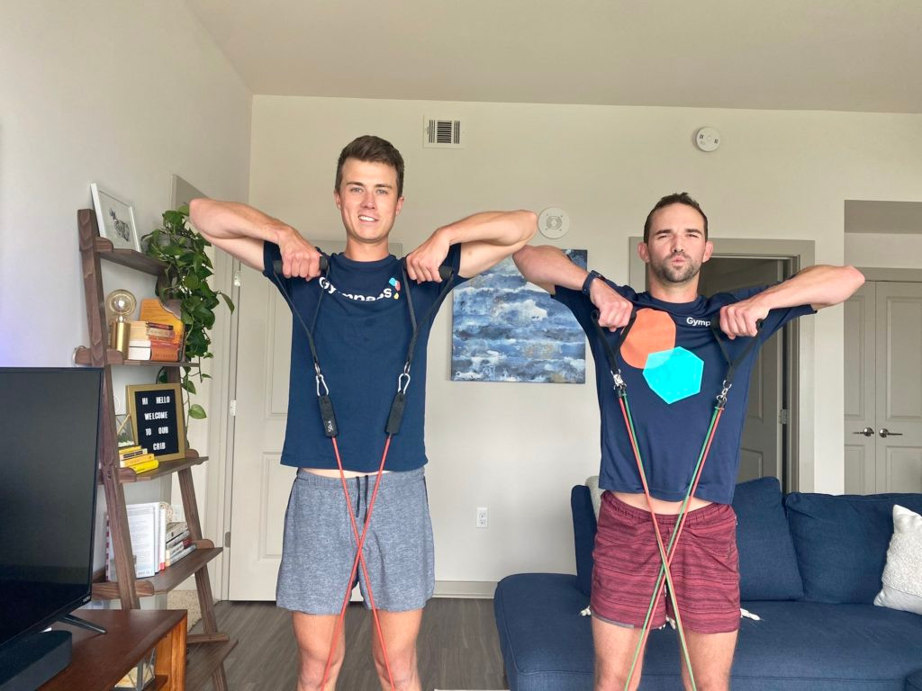 Blaine and his partner working out with bands