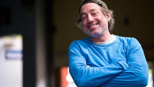 Greg Glassman smiling with arms crossed