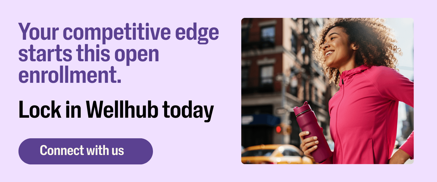 Promotional banner for open enrollment featuring a smiling woman in athletic wear holding a water bottle. Text reads “Your competitive edge starts this open enrollment. Lock in Wellhub today.” Button says “Connect with us.”