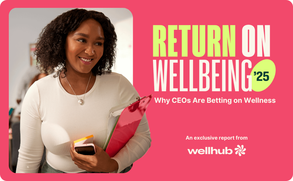 Smiling woman holding a folder and phone; text reads “Return on Wellbeing '25 – Why CEOs Are Betting on Wellness,” with Wellhub branding.