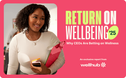 Smiling woman holding a folder and phone; text reads “Return on Wellbeing '25 – Why CEOs Are Betting on Wellness,” with Wellhub branding.